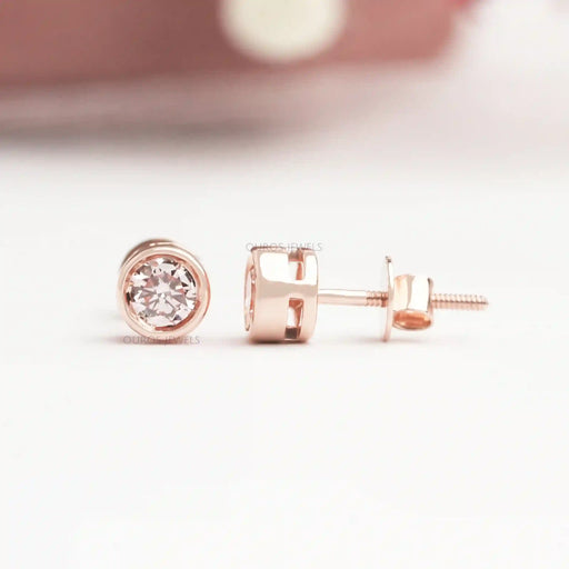 front back view of bezel set pink round cut diamond screw back stud earrings