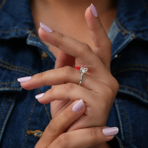 In Finger Side View Of Pear Cut Diamond Three Stone Engagement Ring