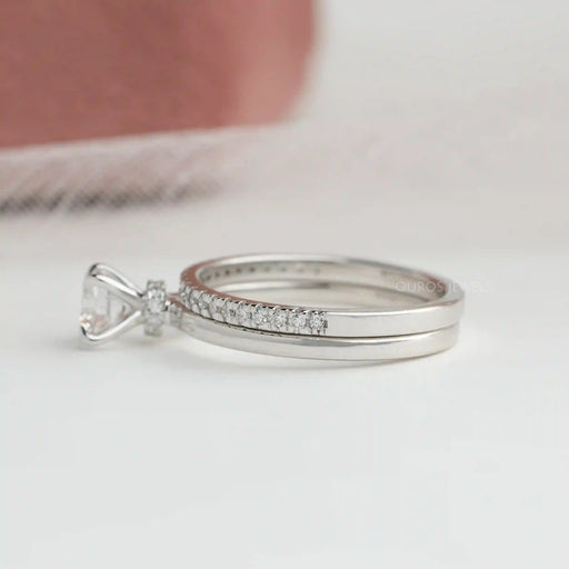 side view of round-cut lab-grown diamond bridal ring set with white gold band