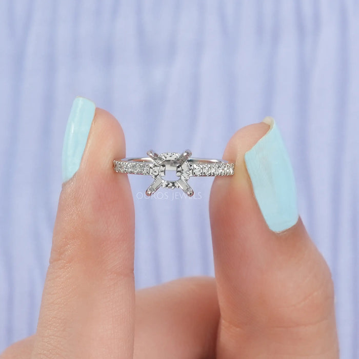 close view of round-shaped hidden halo semi-mount engagement ring