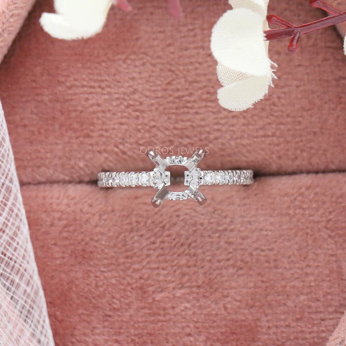 round-shaped hidden halo semi-mount engagement ring in jewelry box