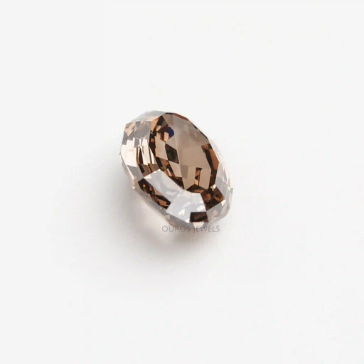 side view of step cut champagne oval shape loose lab diamond
