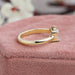 toi et moi engagement ring in yellow gold kept on soft box