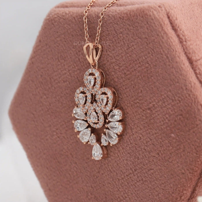 Side view of Pear shape halo diamond necklace in rose gold 