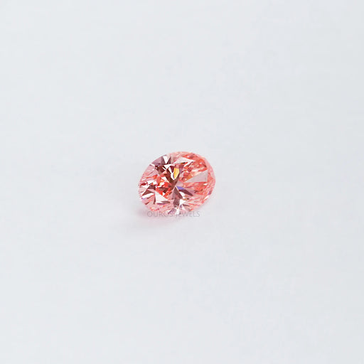 side view of 0.6 carat pink oval cut lab grown diamond loose