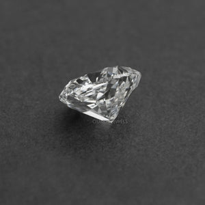 Side view of 2.5 Carat Cushion Cut Loose Diamond displayed on Dark Gray Surface.