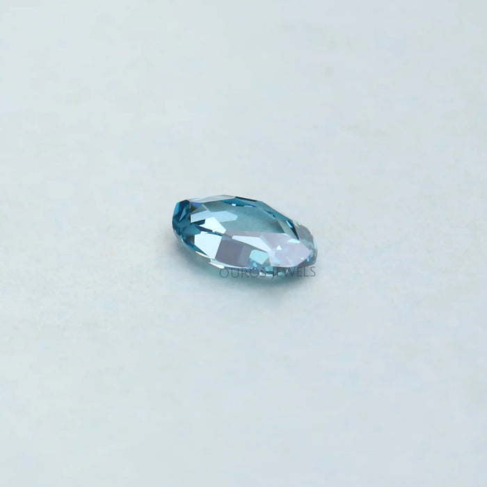 side view of 0.53 carat rose cut blue oval cut loose manufatured diamond