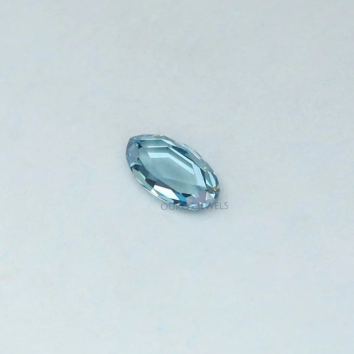 side view of 0.53 carat rose cut blue oval cut lab diamond loose
