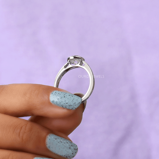 back side view of old european round cut diamond bezel set engagement ring