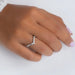 In finger front look of diamond nesting wedding ring made with round and baguette cut diamonds