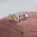 yellow princess cut halo diamond stud earrings in white gold